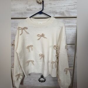 Elegant Cream Sweater with Bow Accents